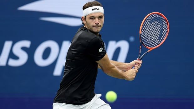 American tennis player Taylor Fritz returns a shot against Casper Ruud of Norway during their U.S. Open fourth-round men's singles match at USTA Billie Jean King National Tennis Center on Sept. 1, 2024 in New York.