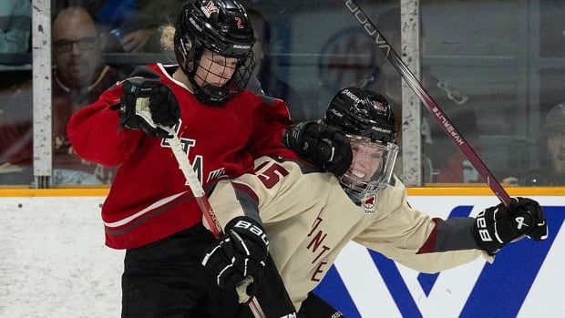 Montreal forward Maureen Murphy gets tied up with Ottawa defender Aneta Tejralola during PWHL action on April 27, 2024 in Ottawa. 