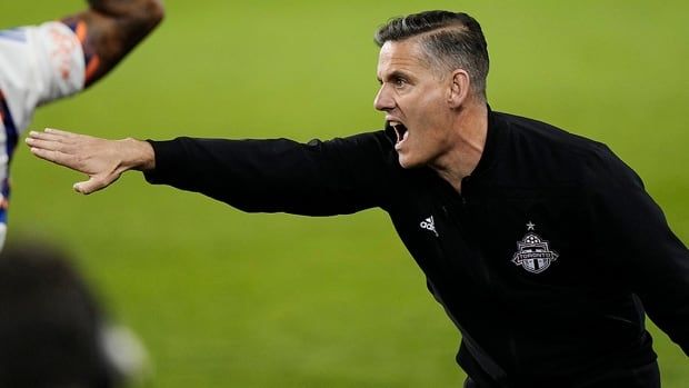 Toronto FC head coach John Herdman instructs his players during a Major League Soccer regular-season match against FC Cincinnati in Toronto on May 25, 2024. 