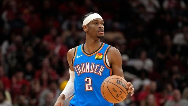 Oklahoma City Thunder guard Shai Gilgeous-Alexander (2) dribbles against the Houston Rockets during the first half of an NBA basketball game Sunday, Feb. 25, 2024, in Houston. 