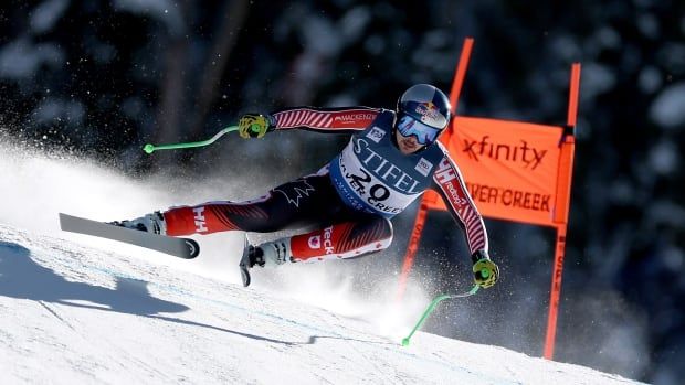 A men's downhill skier competes.