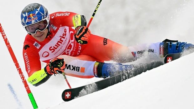 Men's athlete skis down the storied Chuenisbärgli course in Adelboden, Switzerland en route to victory at a giant slalom World Cup event.