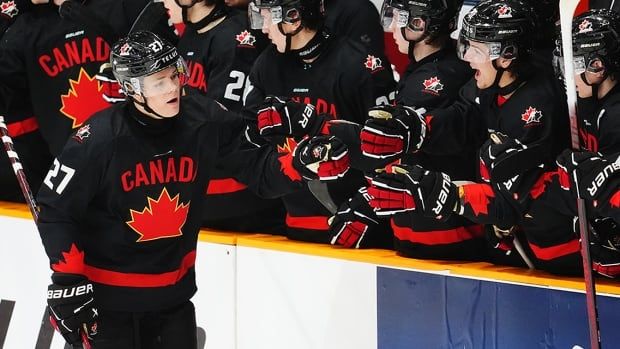 Canadian forward Easton Cowan celebrates his goal against Switzerland during the third period of a pre-world junior hockey championship game in Ottawa on December 19, 2024.