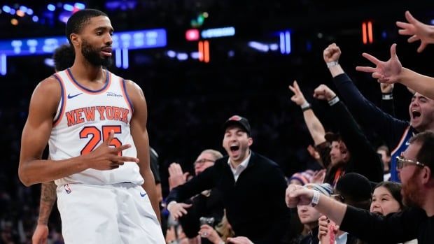 A basketball player celebrates.