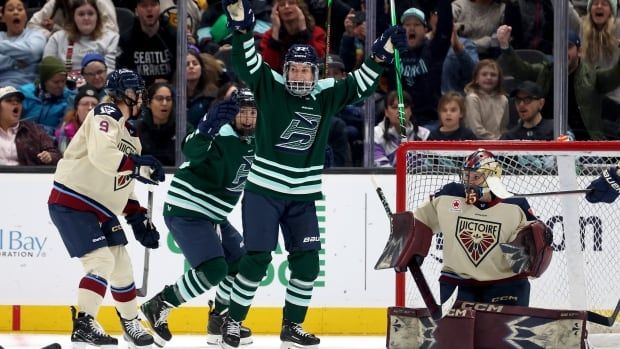 A hockey player celebrates a goal.