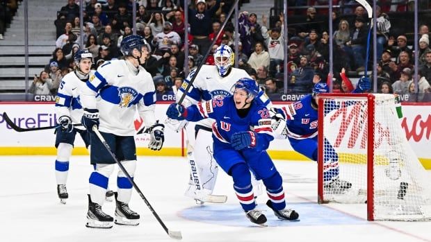 A hockey player celebrates a goal.