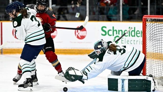 Three female hockey players.