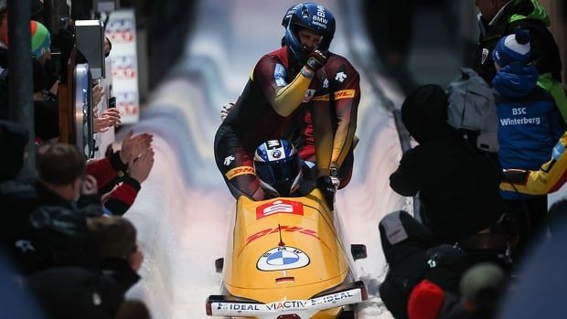 Men's bobsled team from Germany crosses the finish line during World Cup competition at home in Winterberg.