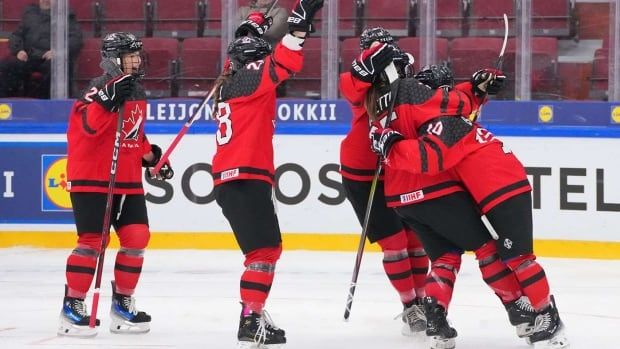 Hockey players celebrate.