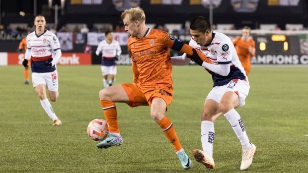 Hamilton Forge FC midfielder Kyle Bekker (10) fights for a ball with Chivas Guadalajara defender Leonardo Sepulveda (43) during round one of the 2024 CONCACAF Champions Cup in Hamilton, Ont. on Wednesday, February 7, 2024.