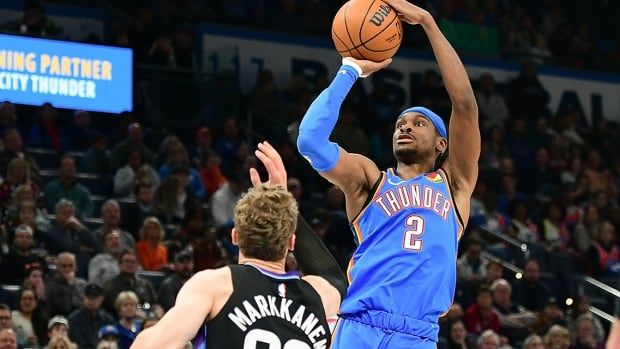 Oklahoma City Thunder guard Shai Gilgeous-Alexander, from Hamilton, shoots over Utah Jazz forward Lauri Markkanen during the first half of an NBA regular-season game on January 22, 2025 in Oklahoma City.