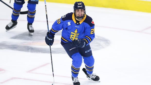 Women's hockey player celebrating a goal