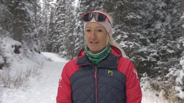 A woman wearing ski gear.