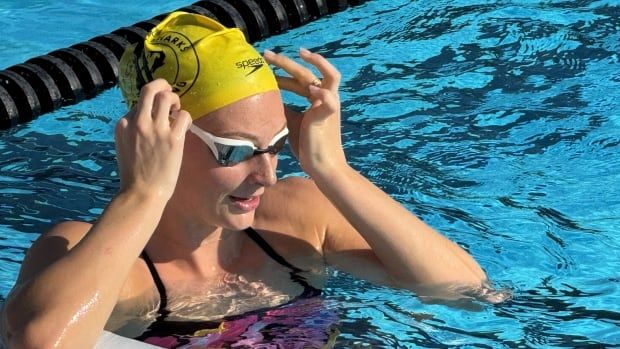 A female swimmer in the pool.