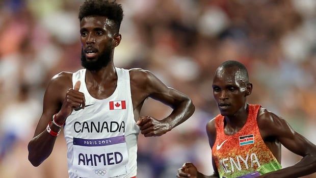 Canadian distance runner Moh Ahmed competes in the Olympic men’s 10,000-metre final at Stade de France in Paris on August 2, 2024.