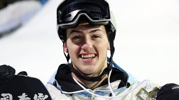 Canadian men's snowboarder poses with a gold medal after winning the snowboard knuckle huck final of the X Games on Jan. 26, 2024, in Aspen, Colo.