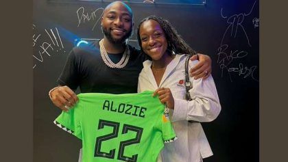 Super Falcons defender, Michelle Alozie gifts jersey to Davido in US