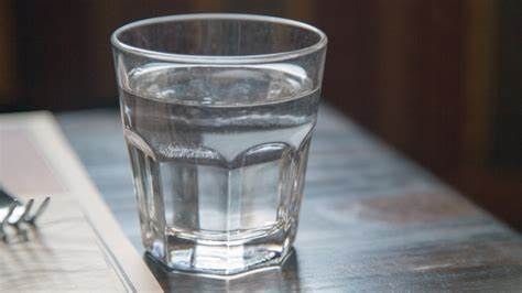 A cup filled with liquid used to illustrate the story