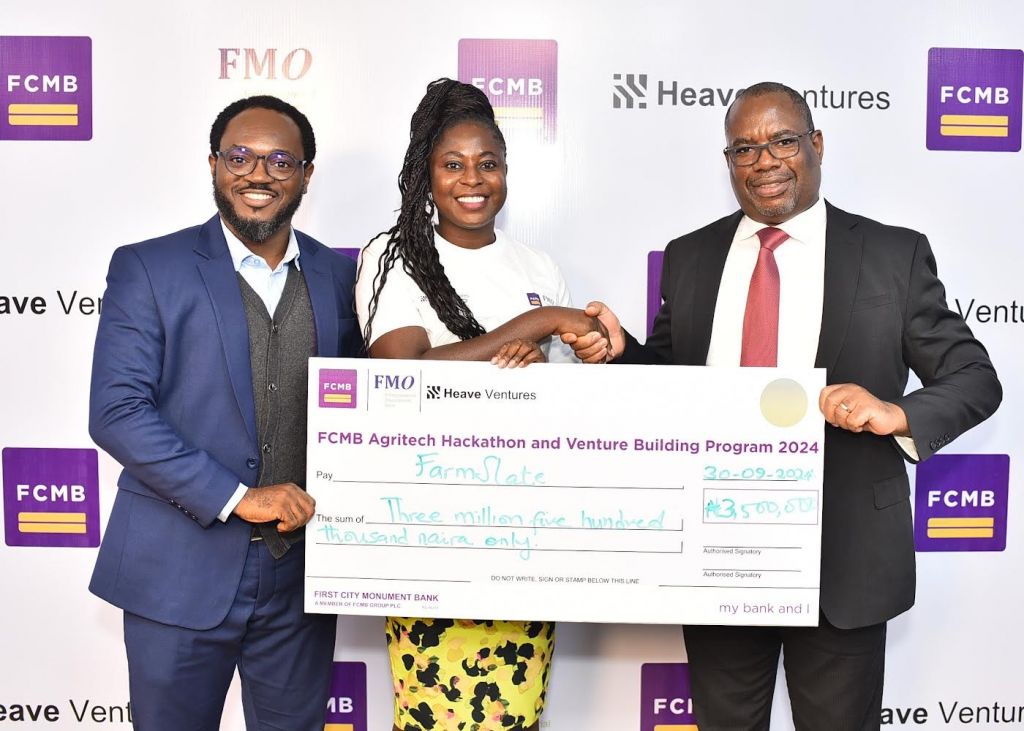 L-R: Head, Agribusiness & Structured Trade Commodity Finance, First City Monument Bank (FCMB), Mr Daniel Olorunsuyi; Winner of the FCMB Agritech Hackathon, Ifeoluwa Olatayo of FarmSlate and Divisional Head, Agribusiness, FCMB, Mr Kudzai Gumunyu, during the presentation of cheque to winners of the Hackathon in Lagos recently. The FCMB Agritech Hackathon was in partnership with Heave Ventures and supported by the Dutch Entrepreneurial Development Bank