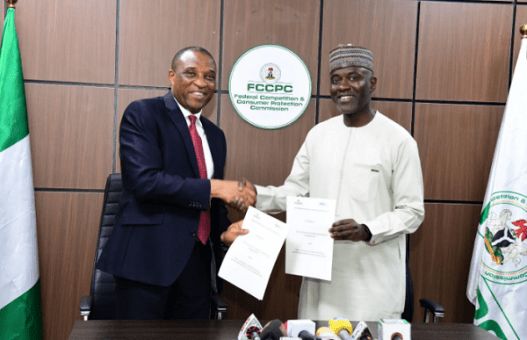 From Left: Executive Vice Chairman/CEO, Federal Competition and Consumer Protection Commission, Tunji Bello and Executive Vice Chairman/CEO, Nigerian Communications Commission, Aminu Maida, during the Memorandum of Understanding (MoU) signing ceremony between the two regulatory agencies for increased telecom consumer protection in Abuja on Tuesday