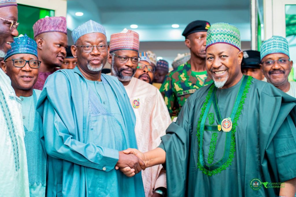 Governor Namadi (left) in handshake with Muhammad Badaru during the visit