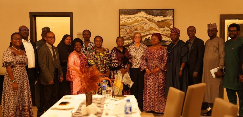 L-R: Temilade Sesan; Ismail Ibraheem; Adejoke Orelope-Adefulire; Diana Mitlin, and the representative of Global Development Institute's ALumni Association in Nigeria, Kayode Adaramodu, at the dinner in Abuja recently. (PHOTO CREDIT: ACRC)