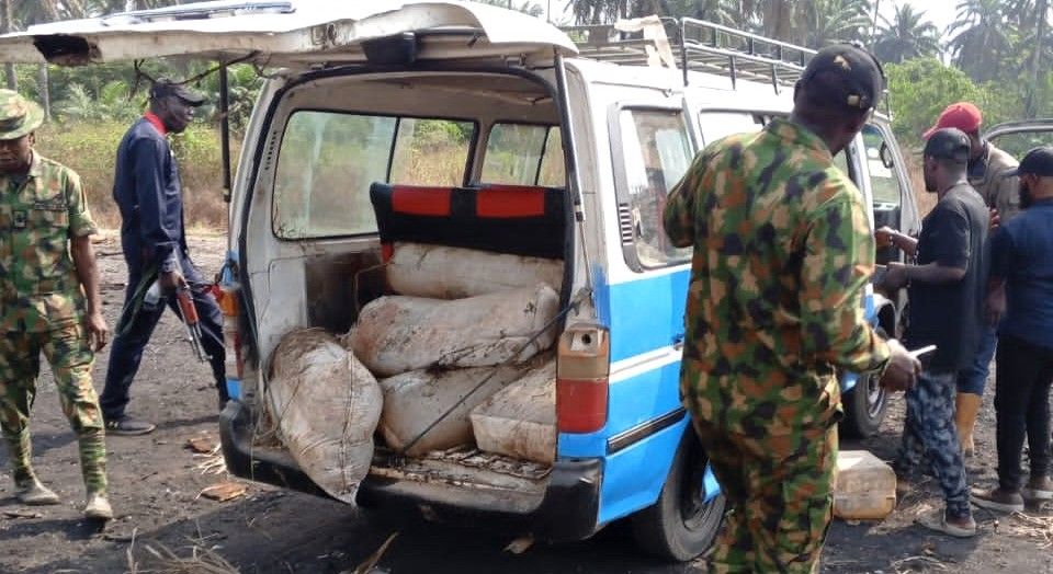 Nigerian-Army intercepts commercial bus in Rivers, transporting over 1500 litres of stolen crude oil hidden in sack bags Photo credit NAN