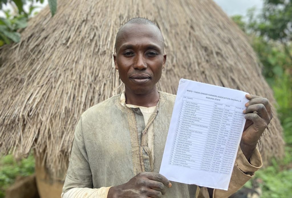 Neyu Thomas shows a list of farmers in his community association