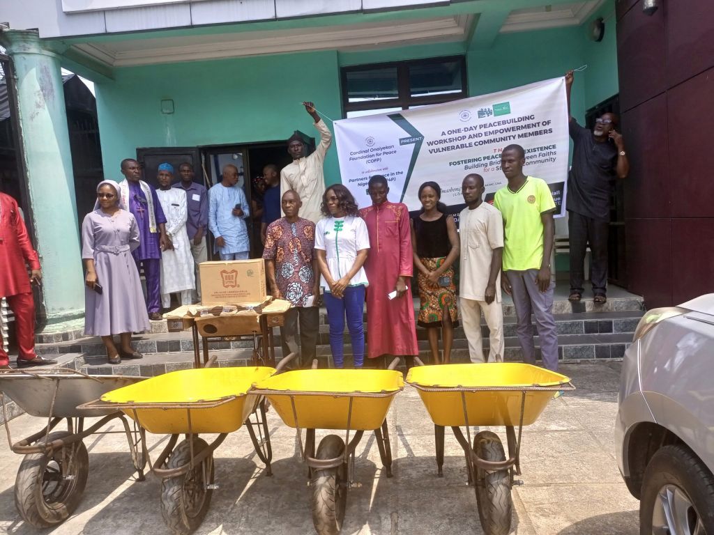 Imaobong Nnsewo, convener, (in Jean trouser) with beneficiaries of the empowerment items