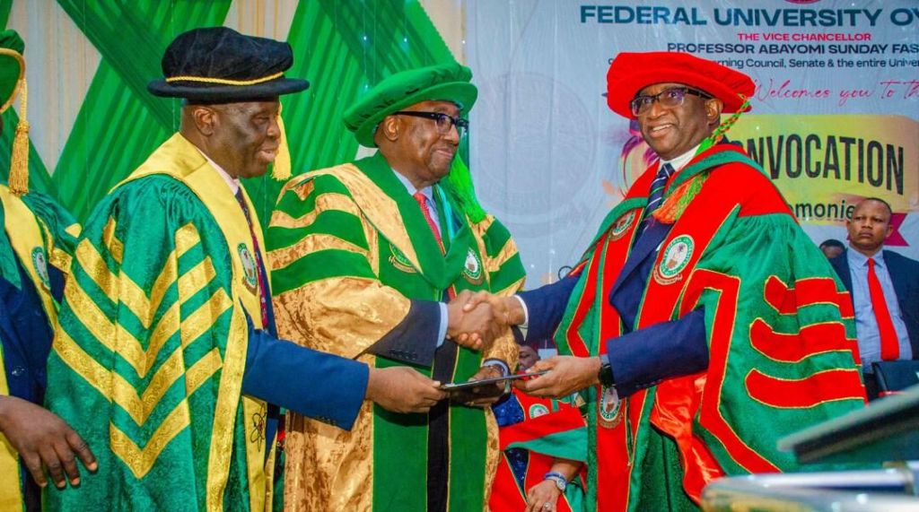 L-R: Vice-Chancellor of Federal University, Oye-Ekiti (FUOYE), Professor Abayomi Sunday Fasina presenting a Ph.D certificate (Honoris Causa) to former Attorney-General of the Federation, Chief Adebayo Ojo, in a handshake with Pro Chancellor and Chairman, Governing Council of FUOYE, Sen. Victor Ndoma-Egba, during the 9th Convocation ceremony of the university in Oye-Ekiti on Saturday.