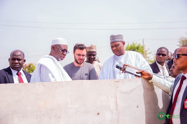 Governor Umar Namadi of Jigawa State, the contractor and other officials at the inspection site