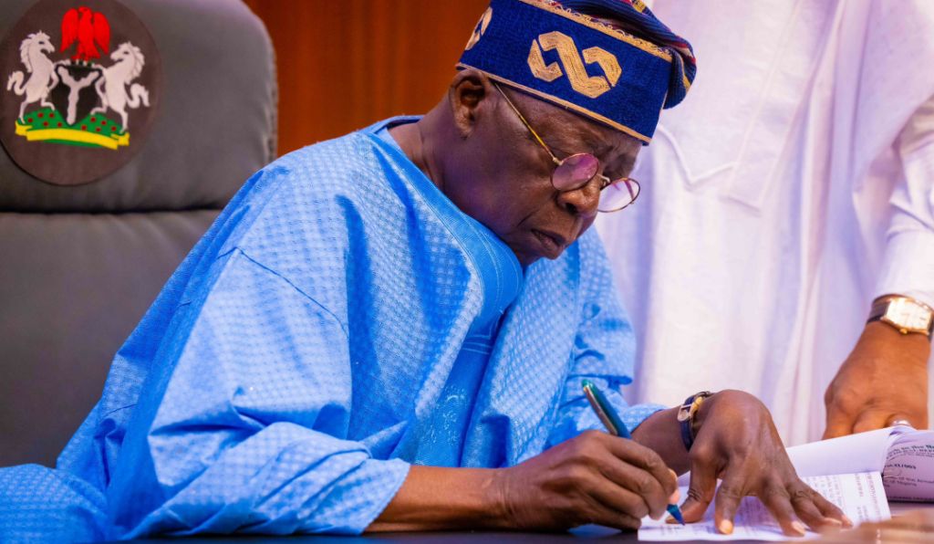 President Bola Tinubu has signing a document