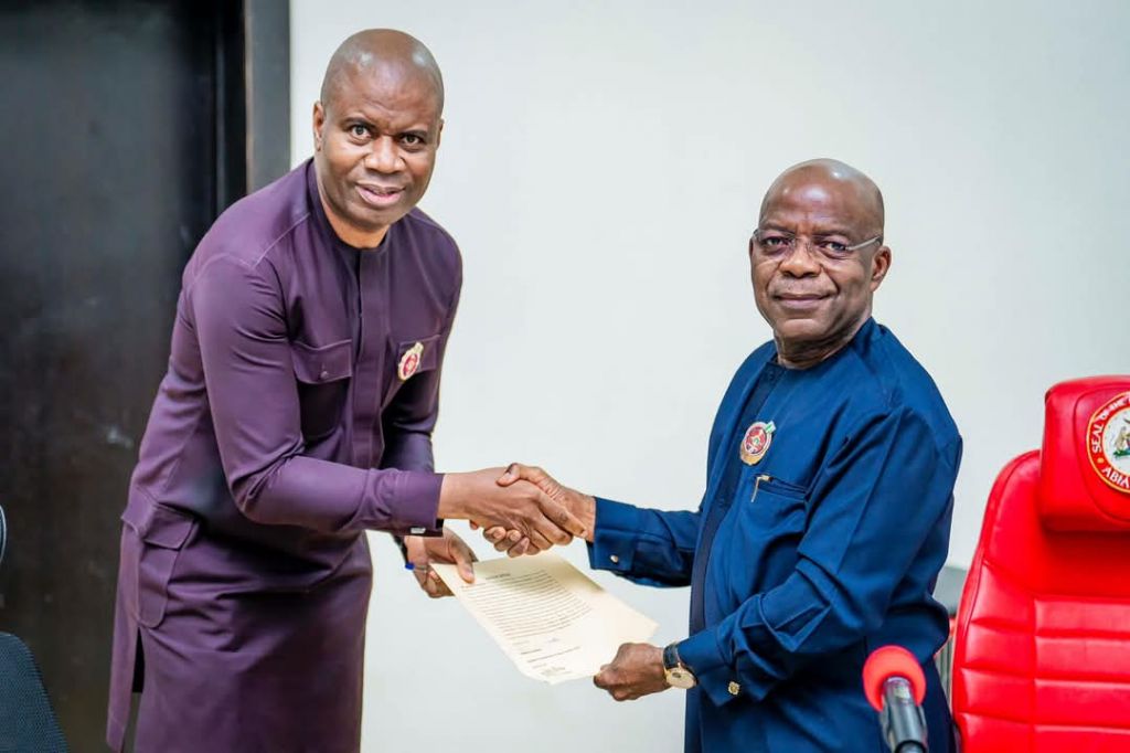 The new Abia head of civil service, Benson Ojeikere, being sworn in by Gov Alex Otti