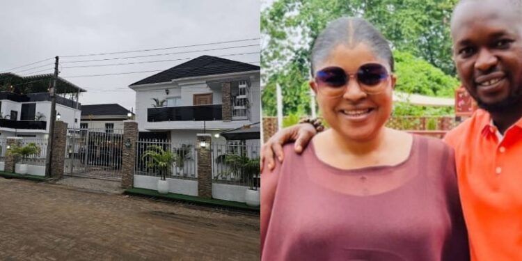 The Afolayans pictured alongside their mansion