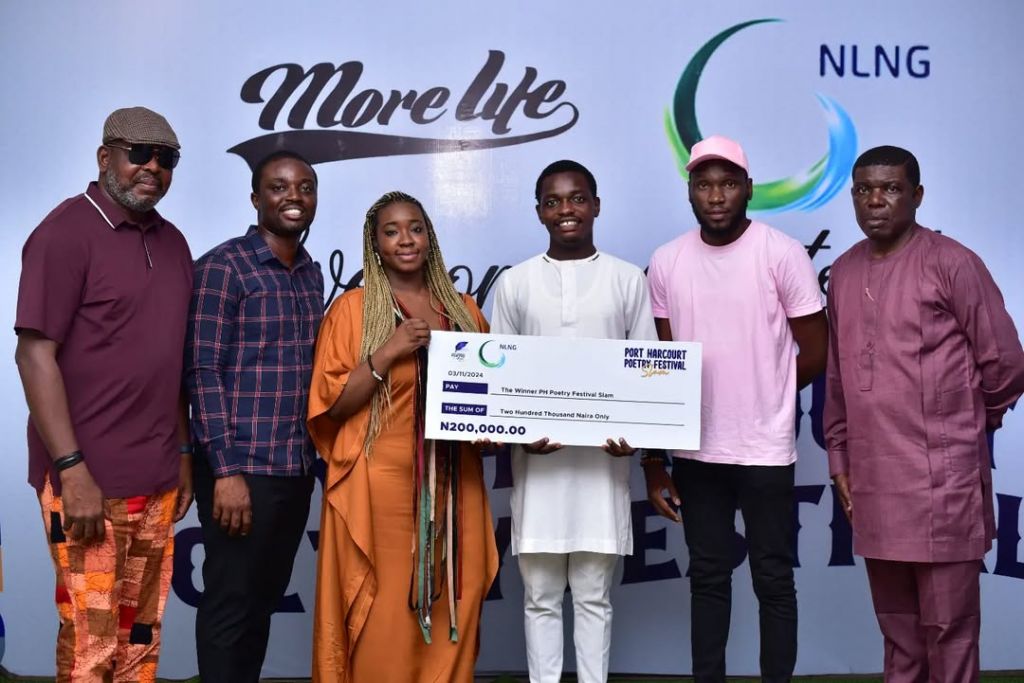 Justice Amakiri (4th from left) receiving the N200,000 Port Harcourt Poetry Festival Slam prize