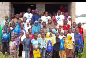 Some members of Ibironke Adeagbo Foundation with some children