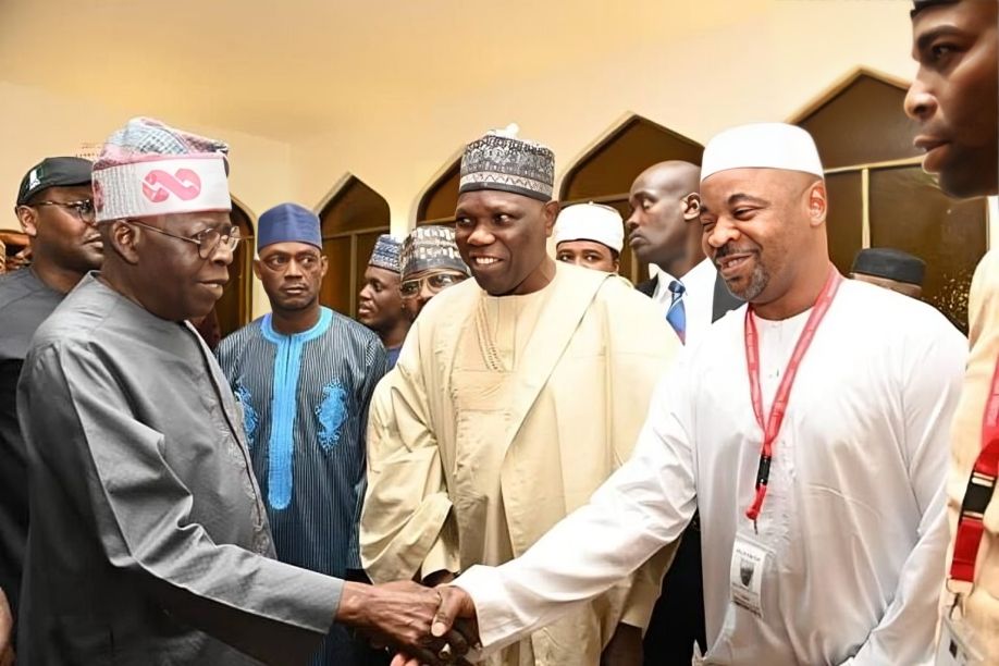 L-R: President Bola Tinubu shook hands with the new NURTW national chairman, Musiliu Akinsanya, popularly known as MC Oluomo. [X, formerly Twitter]