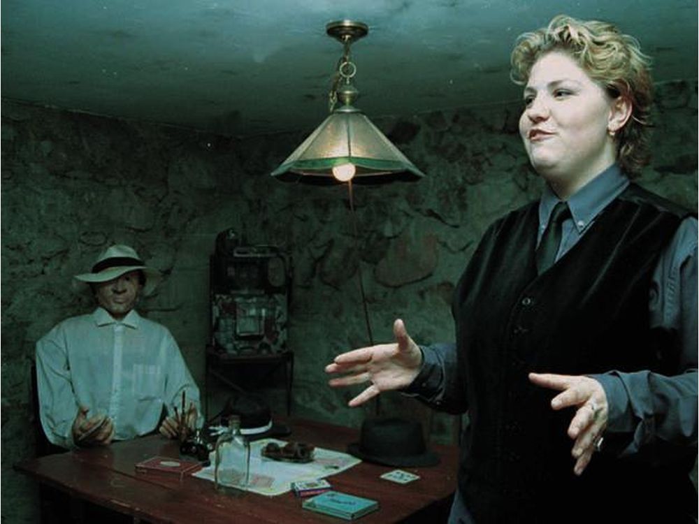 A Tunnels of Little Chicago guide, right, discusses some of Moose Jaw s colourful history inside one of the underground tunnels in the city. (Moose Jaw Times-Herald photo) [PNG Merlin Archive]