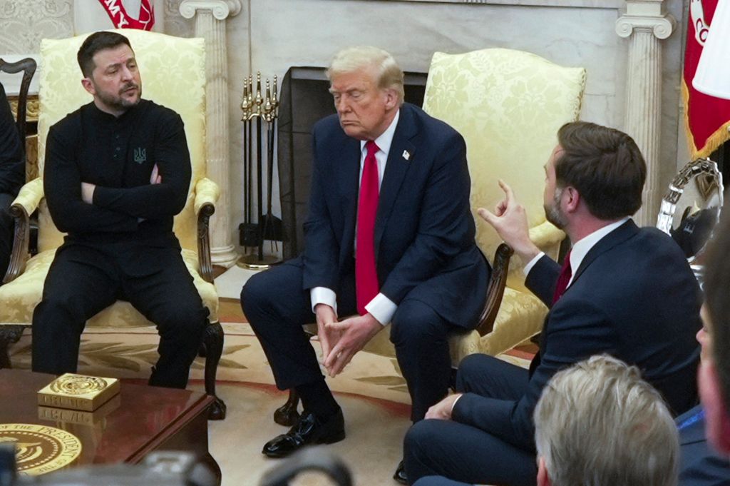 Vice President JD Vance, right, speaks with Ukrainian President Volodymyr Zelenskyy, left, as President Donald Trump listens in the Oval Office at the White House, Friday, Feb. 28, 2025, in Washington. (AP Photo/ Mystyslav Chernov)