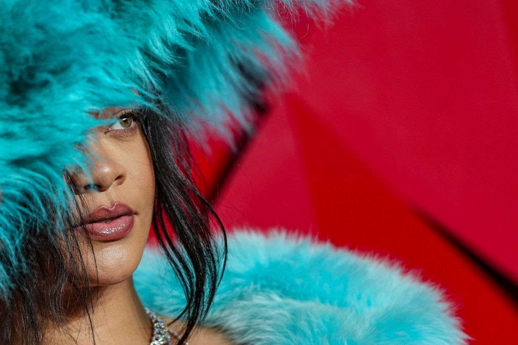 Rihanna poses for photographers upon arrival at the The Fashion Awards 2024, in London, Dec. 2, 2024. (Photo by Scott A Garfitt/Invision/AP)