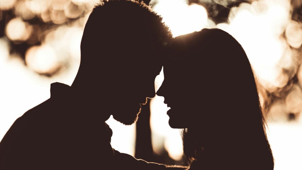 Silhouette of a couple in profile