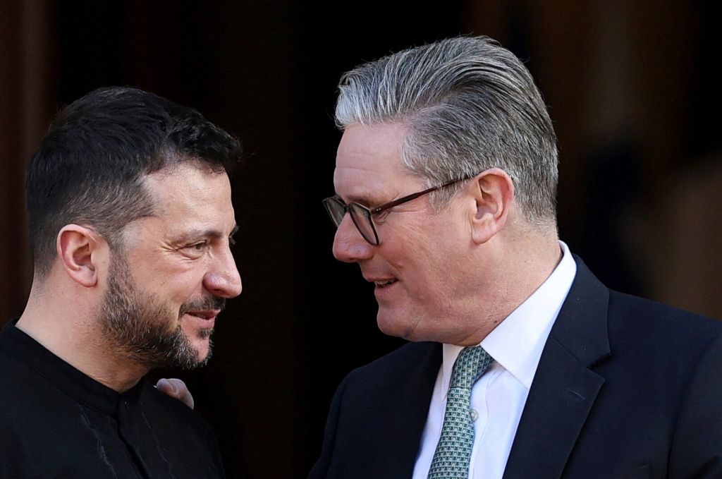 Britain's Prime Minister Keir Starmer, right, welcomes Ukrainian President Volodymyr Zelenskyy to the European leaders' summit to discuss Ukraine, at Lancaster House, London, Sunday March 2, 2025.