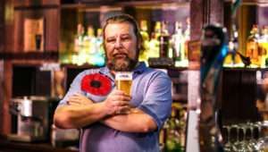 Man wearing massive poppy