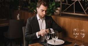 Man in restaurant waiting with an empty plate