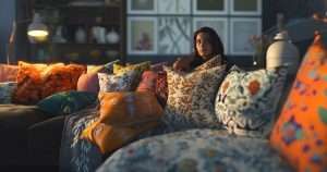 woman on the sofa with lots of cushions