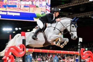 Matt Sampson and Daniel win the Christmas Pudding Stakes showjumping competition at the London International Horse Show at the London ExCeL.