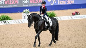 Lottie Fry and Glamourdale in the London Horse Show dressage grand prix 2024.