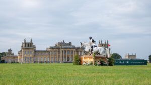 Blenheim European Eventing Championships cross-country course designer revealed as Captain Mark Phillips. Library image shows a horse and rider jumping a cross-country fence in front of Blenheim Palace in 2024.