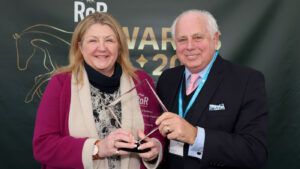 Grace Muir receives the Sir Peter O’Sullevan RoR Community Impact award from RoR chairman David Thorpe.