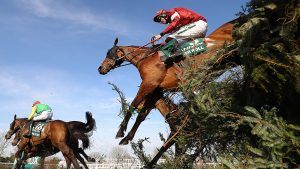 Grand National tickets LIVERPOOL, ENGLAND - APRIL 06: Davy Russell riding Tiger Roll (R) clears Canal Turn on his way to winning the 2019 Randox Health Grand National at Aintree Racecourse on April 06, 2019 in Liverpool, England. (Photo by Michael Steele/Getty Images)